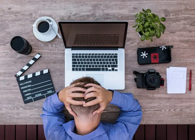 blogger, screenwriter, desperate, unimaginative, uncreative, writer's block, thinking blockade, hair-tearing, headache, workplace, unmotivated, desk, home office, computer, office,. Source use checklist: research trail, quotation, paraphrase and citation